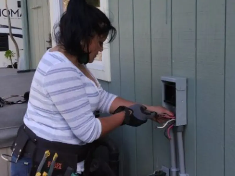 Licensed electrician wiring an exterior subpanel in Monrovia